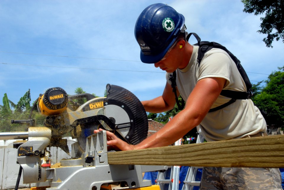 US Navy 080831-N-3595W-067 Air Force Staff Sgt. Alexander Oliver helps to rebuild a school house
