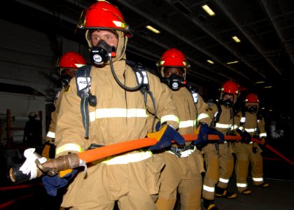 US Navy 080831-N-3885H-029 Sailors assigned to Pre-Commissioning Unit (PCU) George H.W. Bush (CVN 77) participate in a firefighting drill