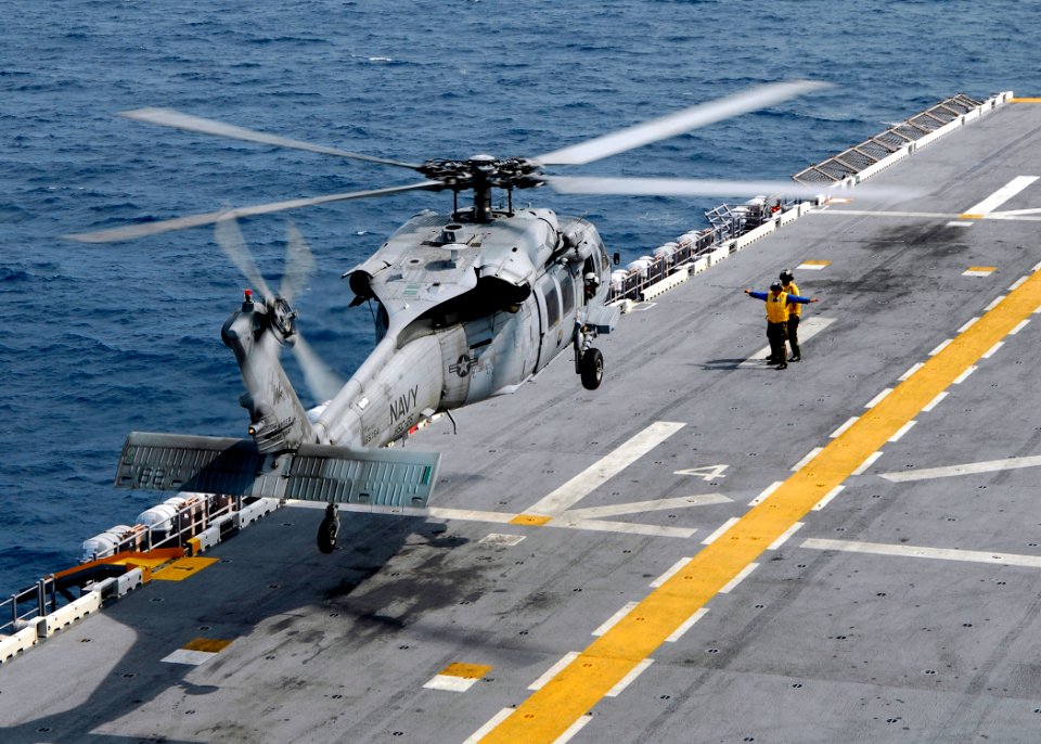 US Navy 080828-N-4236E-589 An MH-60S Sea Hawk helicopter lands on the flight deck of the multi-purpose amphibious assault ship USS Iwo Jima (LHD 7)