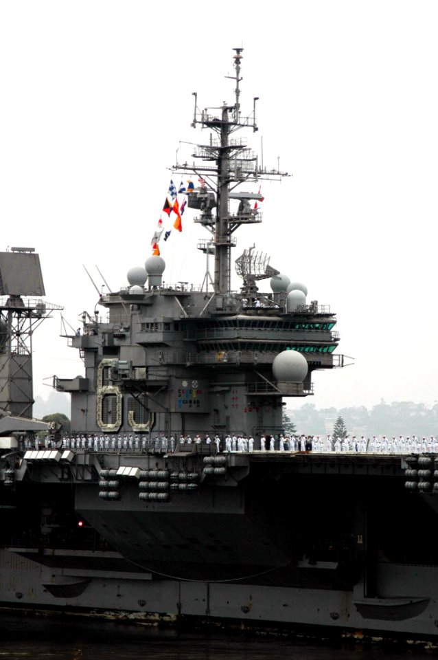 US Navy 080828-N-9076B-005 Sailors man the rail of the aircraft carrier USS Kitty Hawk (CV 63)