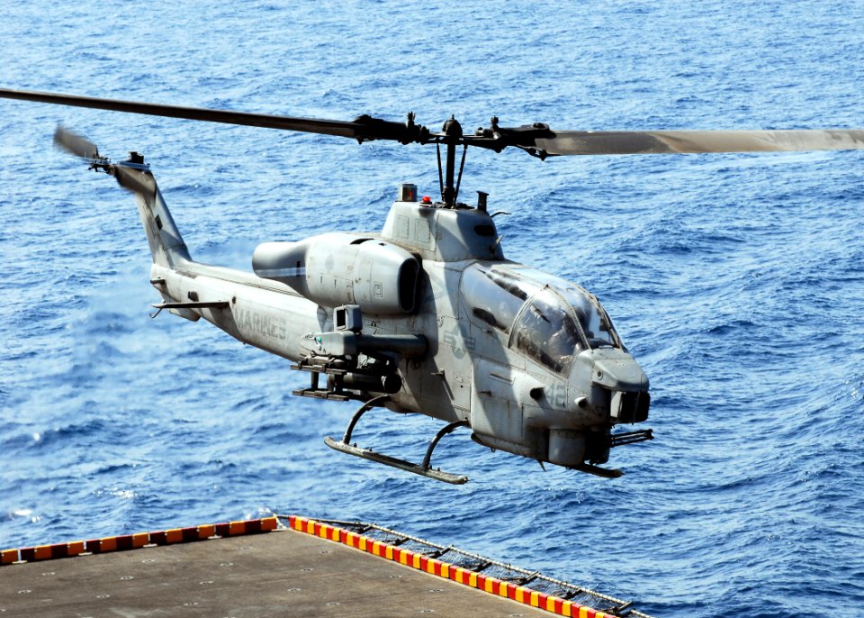 US Navy 080902-N-2183K-122 AH-1W Super Cobra helicopter launches off the flight deck of the amphibious assault ship USS Peleliu (LHA 5)