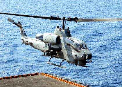 US Navy 080902-N-2183K-122 AH-1W Super Cobra helicopter launches off the flight deck of the amphibious assault ship USS Peleliu (LHA 5)
