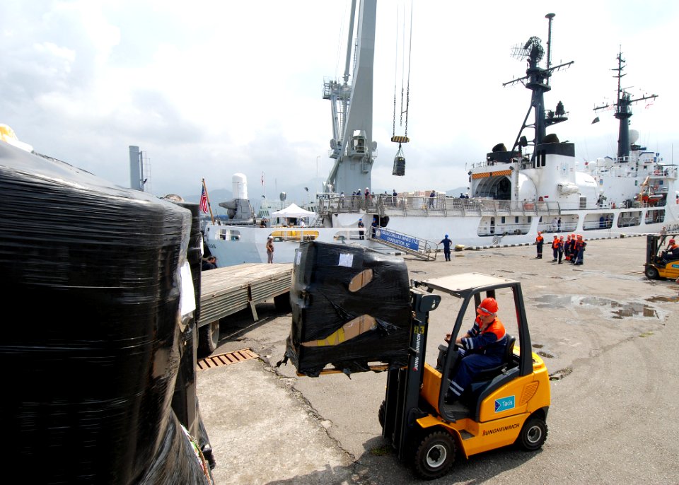 US Navy 080827-N-4044H-035 A Georgian pier worker loads a pallet of humanitarian assistance supplies onto the back of a truck