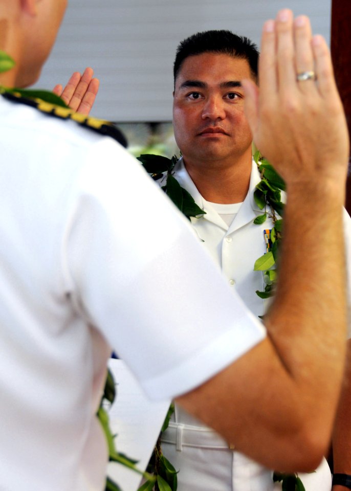 US Navy 080902-N-9758L-046 Native Hawaiian Cmdr. Mel Yokoyama, executive officer of Cruise Missile Support Activity, Pacific, listens to the oath of appointment during his promotion ceremony at the U.S. Pacific Fleet boathouse
