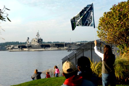 US Navy 080902-N-9928E-094 Local Bremerton citizens watch as the aircraft carrier USS Kitty Hawk (CV 63) enters Puget Sound Naval Shipyard