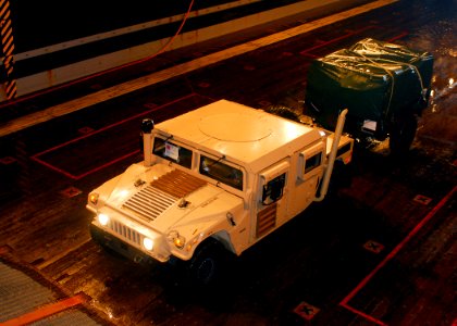 US Navy 080827-N-5681S-010 Equipment from a landing craft air cushion assigned to Assault Craft Unit (ACU) 4 is driven into the well deck of the multi-purpose amphibious assault ship USS Iwo Jima (LHD 7)