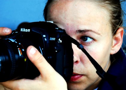 US Navy 080903-N-2183K-013 Mass Communication Specialist 3rd Class Sarah Bitter composes an image during a photo shoot aboard the amphibious assault ship USS Peleliu (LHA 5)