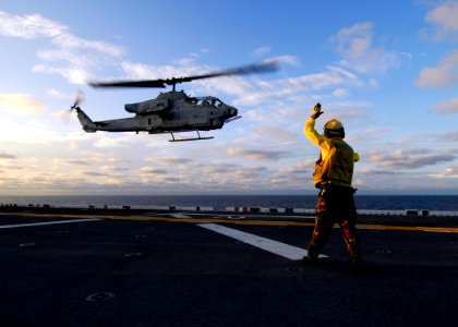 US Navy 080830-N-4236E-113 Aviation Boatswain's Mate Handling 3rd Class Lataf Bush launches an AH-1W Cobra