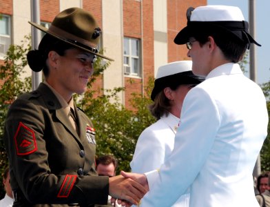 US Navy 080829-N-8848T-896 Marine Gunnery Sgt. Sandra Center, a drill instructor at Officer Candidate School, congratulates Ensign Elizabeth Swart, from Harbert, Mich., photo