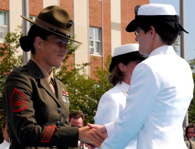 US Navy 080829-N-8848T-896 Marine Gunnery Sgt. Sandra Center, a drill instructor at Officer Candidate School, congratulates Ensign Elizabeth Swart, from Harbert, Mich.,