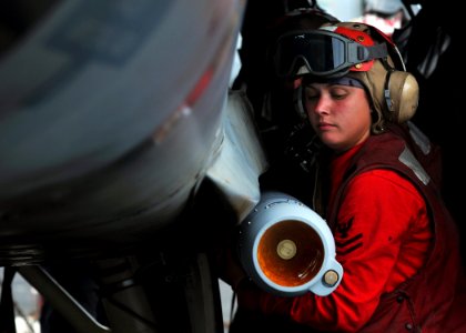US Navy 080903-N-7981E-079 Aviation Ordnanceman 2nd Class Jennifer Smolinsky, from Erie, Pa., works with other aviation ordnancemen assigned to the