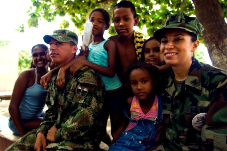 US Navy 080831-N-9620B-263 Store Keeper 2nd Class Judith Bahanmon sits down with a Colombian Soldier
