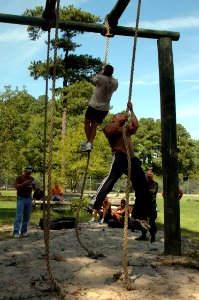 US Navy 080903-N-9095H-121 Navy Expeditionary Combat Command (NECC) personnel compete in the rope climb event during the NECC inaugural Toughman Competition