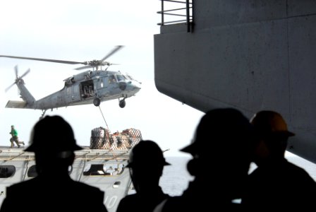US Navy 080904-N-1635S-001 An MH-60S Sea Hawk delivers a pallet of supplies