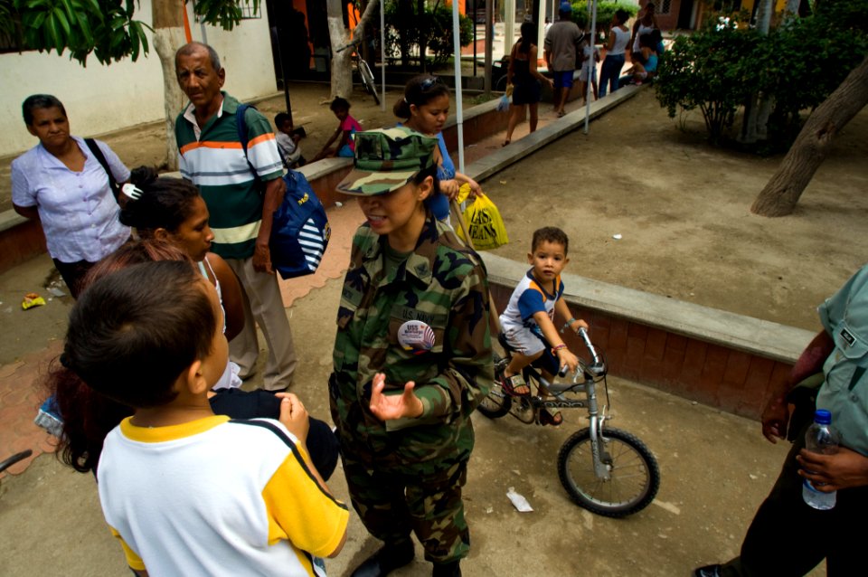 US Navy 080831-N-9620B-251 Store Keeper 2nd Class Judith Bahanmon speaks with locals