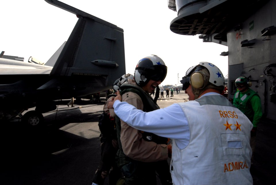 US Navy 080901-N-7730P-128 Rear Adm. Scott R. Van Buskrik is greeted on the flight deck of the Nimitz-class aircraft carrier USS Ronald Reagan (CVN 76)