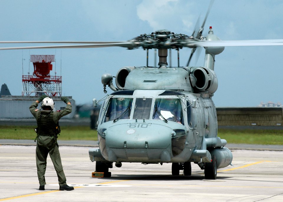 US Navy 080901-N-1522S-005 A helicopter crew prepare to depart Naval Air Station Jacksonville