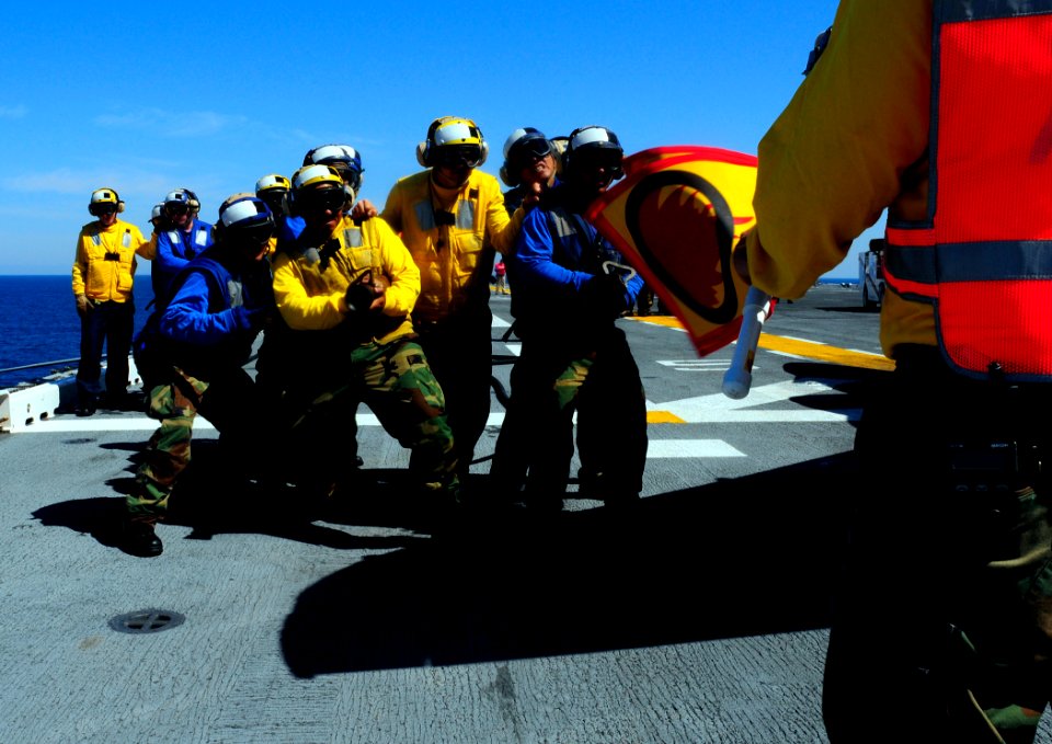US Navy 080902-N-1688B-196 Aviation boatswain's mates practice their firefighting skills on the flight deck of the multi-purpose amphibious assault ship USS Bataan (LHD 5) during HURREX 08-002