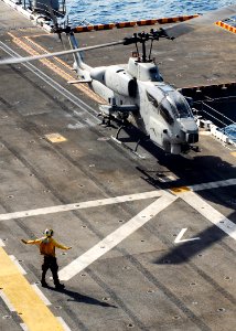 US Navy 080902-N-2183K-160 An AH-1W Super Cobra helicopter touches down on the flight deck of the amphibious assault ship USS Peleliu (LHA 5)