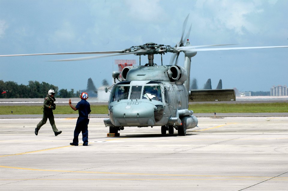 US Navy 080901-N-1522S-008 A helicopter crew prepare to depart Naval Air Station Jacksonville
