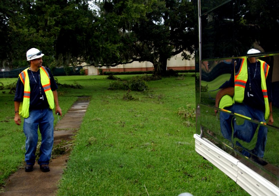 US Navy 080902-N-3285B-036 Kevin Macias assesses the damage from Hurricane Gustav