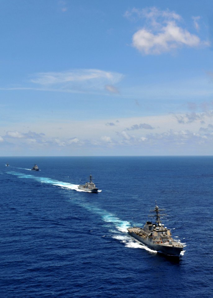 US Navy 080905-N-7981E-044 The Arleigh Burke-class guided-missile destroyers USS Russell (DDG 59) join a formation led by the aircraft carrier USS Abraham Lincoln (CVN 72)