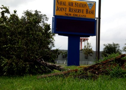 US Navy 080902-N-3285B-016 A fallen tree lays in front of the Fitness Center at Naval Air Station Joint Reserve Base (NAS JRB) New Orleans photo