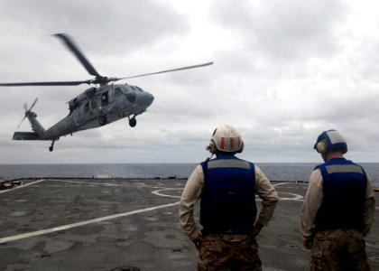 US Navy 080905-N-9134V-001 An MH-60S Sea Hawk assigned to Helicopter Sea Combat Squadron (HSC) 26 lands aboard the amphibious dock landing ship USS Carter Hall (LSD 50)