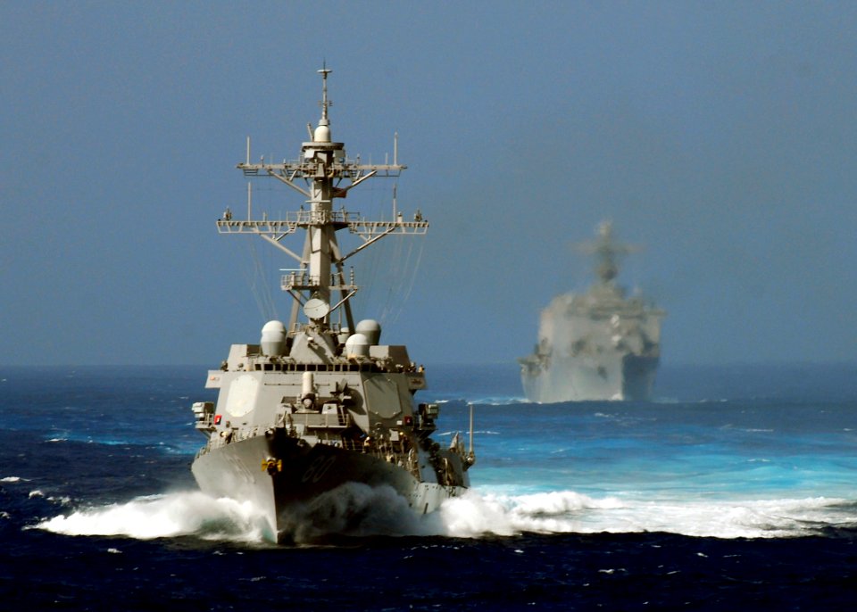 US Navy 080903-N-4236E-103 The guided-missile destroyer USS Roosevelt (DDG 80) maneuvers in front of the amphibious transport dock ship USS Carter Hall (LSD 50)