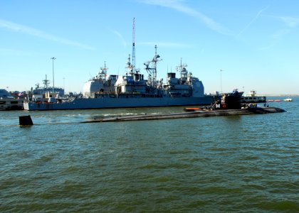 US Navy 080903-N-7705S-077 The Los Angeles class fast-attack submarine USS Oklahoma City (SSN 723) departs Naval Station Norfolk near the Ticonderoga class guided-missile destroyer USS Normandy (CG 60)
