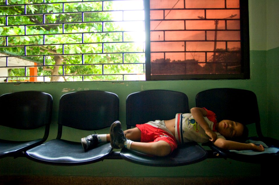 US Navy 080831-N-9620B-284 A local Colombian boy sleeps in a waiting room