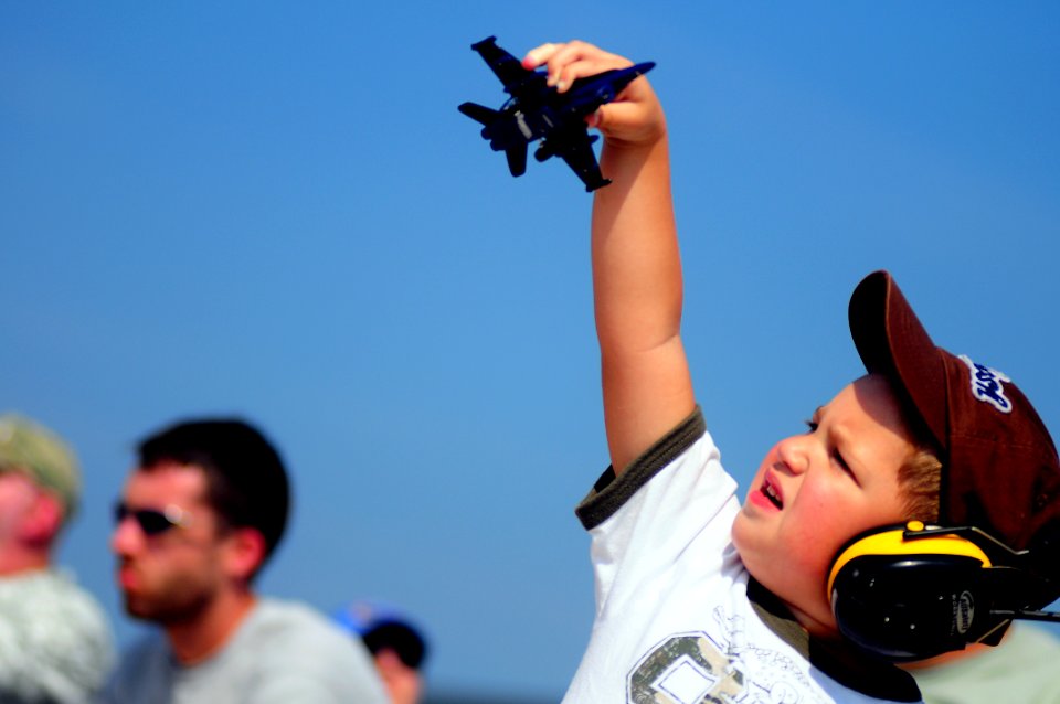 US Navy 080905-N-0411D-007 A boy plays with a model of a Blue Angels plane during the Great State of Maine Air Show at Naval Air Station Brunswick