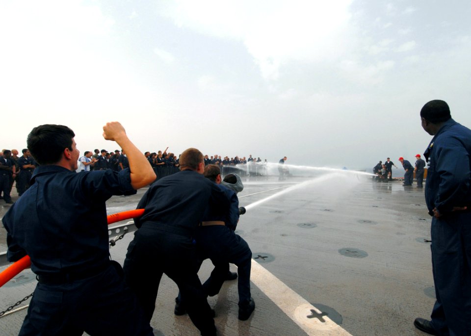 US Navy 080909-N-3392P-054 Sailors participate in a damage control Olympics aboard the amphibious dock landing ship USS Carter Hall (LSD 50)