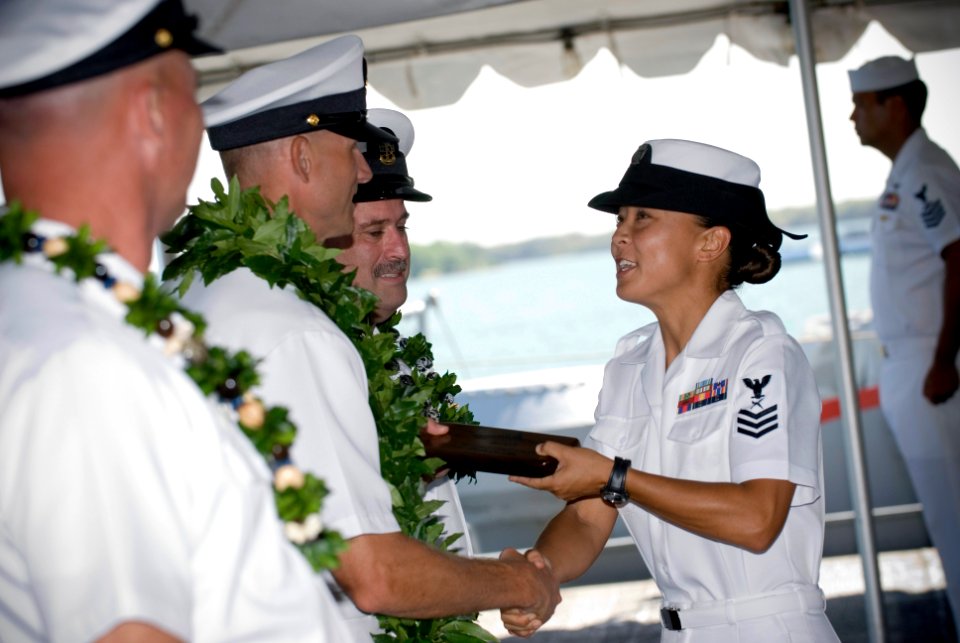 US Navy 080905-N-6674H-001 Cryptologic Technician (Information) 1st Class Amy Abellaneda, a chief selectee assigned to Navy Information Operations Command, Hawaii, receives a plaque at the graduation ceremony at the Battleship