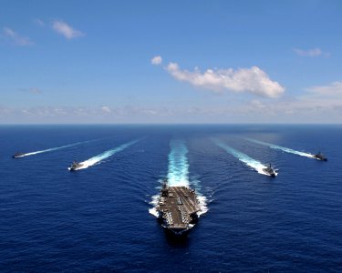 US Navy 080905-N-7981E-845 The aircraft carrier USS Abraham Lincoln (CVN 72) leads a formation of ships from the Abraham Lincoln Strike Group they transit the Indian Ocean