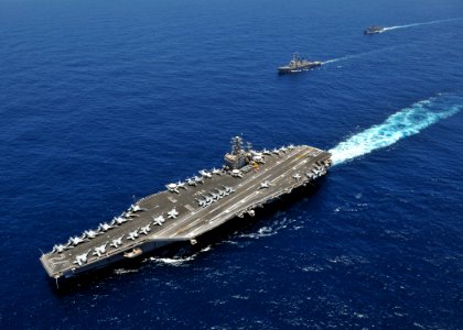 US Navy 080905-N-7981E-435 The aircraft carrier USS Abraham Lincoln (CVN 72) transits the Indian Ocean with the Arleigh Burke-class guided-missile destroyer USS Russell (DDG 59) and the Oliver Hazard Perry-class guided-missile photo