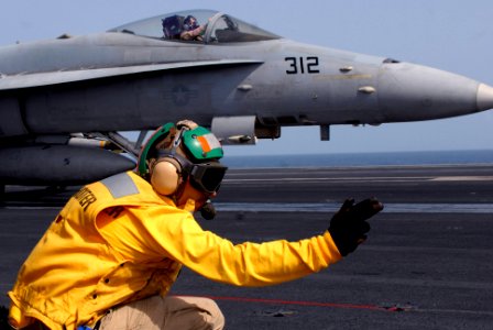 US Navy 080901-N-7730P-038 Shooter Lt. Michael Kamas gives the go sign to launch an F-A-18C Hornet