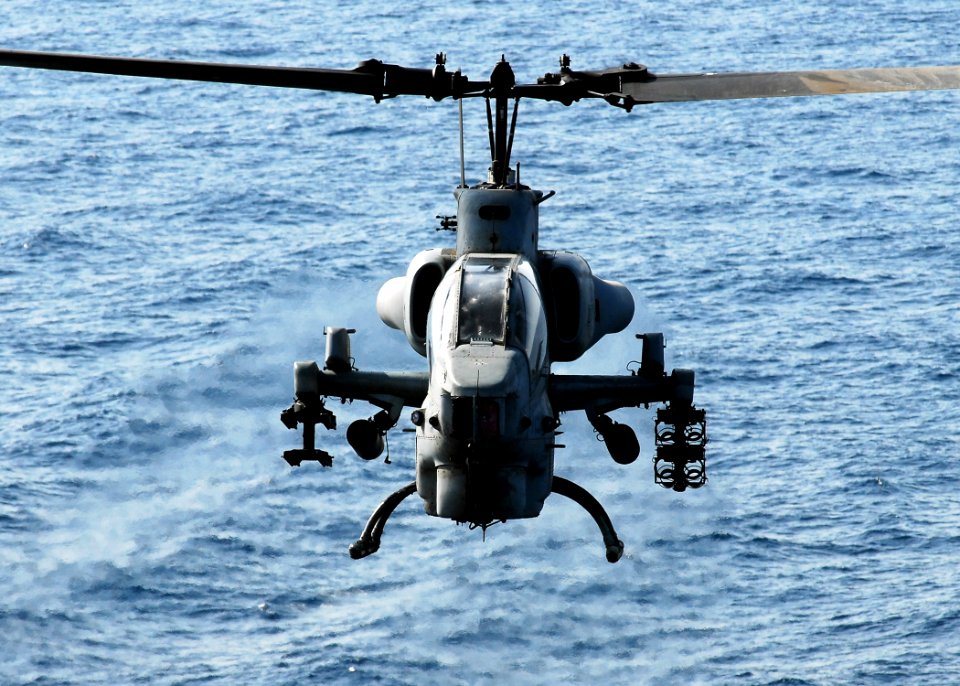 US Navy 080902-N-2183K-137 An AH-1W Super Cobra helicopter approaches the flight deck of the amphibious assault ship USS Peleliu (LHA 5)
