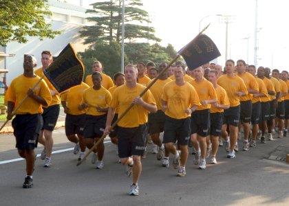 US Navy 080910-N-0483B-008 Chief petty officers and chief petty officer selects assigned to Fleet Activities Yokosuka and Naval Air Facility Atsugi (NAF) conduct a formation physical training run photo