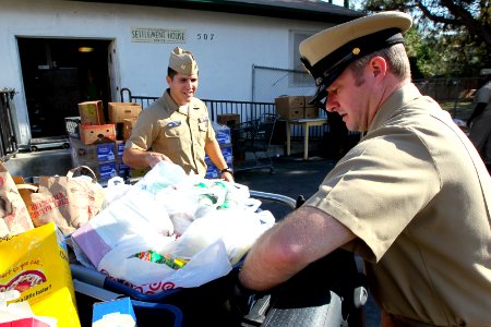 US Navy 111123-N-HW977-261 Sailors deliver NSWC Corona Thanksgiving food drive donations to Corona-Norco Settlement House