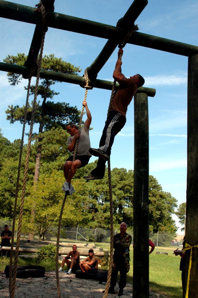 US Navy 080903-N-9095H-120 Navy Expeditionary Combat Command (NECC) personnel compete in the rope climb event during the NECC inaugural Toughman Competition