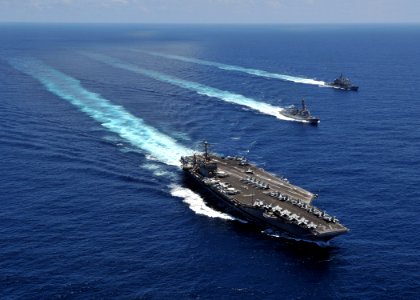 US Navy 080905-N-7981E-855 The aircraft carrier USS Abraham Lincoln (CVN 72) transits the Indian Ocean with the Arleigh Burke-class guided-missile destroyer USS Momsen (DDG 92) and the Ticonderoga-class guided-missile cruiser U photo