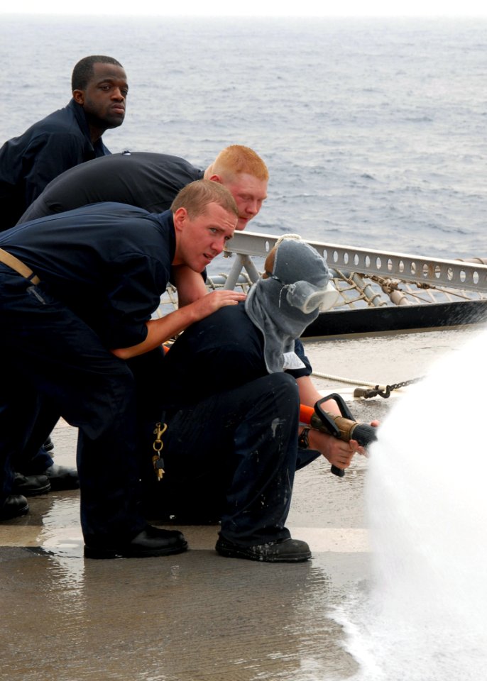 US Navy 080909-N-3392P-028 Sailors participate in a damage control Olympics aboard the amphibious dock landing ship USS Carter Hall (LSD 50)
