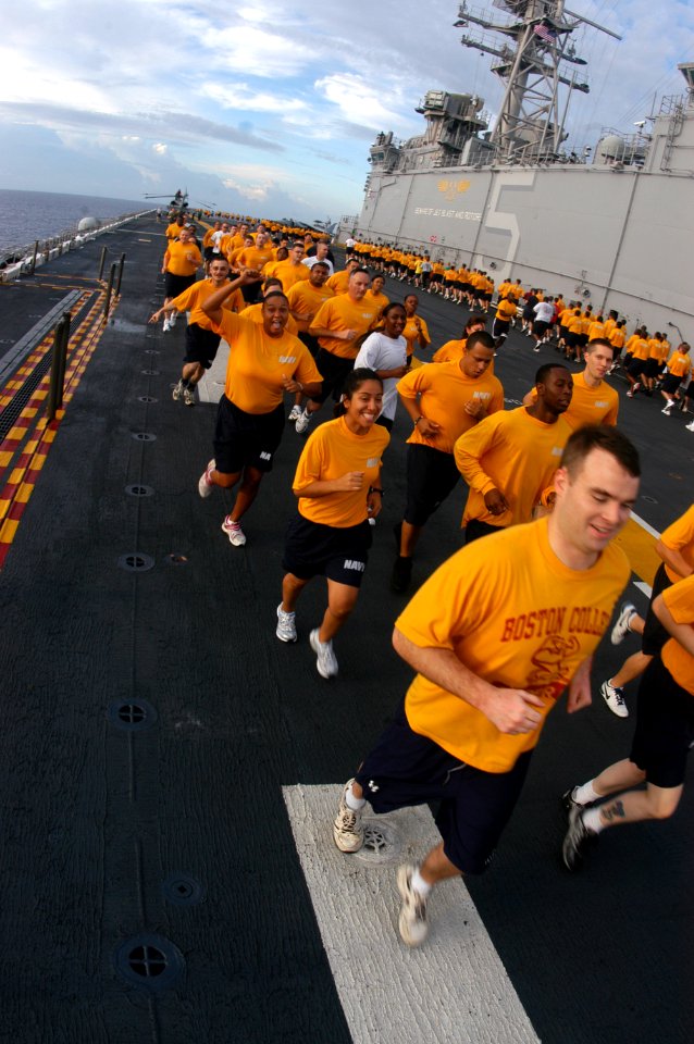 US Navy 080910-N-8154G-058 Sailors aboard the multi-purpose amphibious assault ship USS Bataan (LHD 5) participate in command-wide physical training on the ship's flight deck