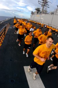 US Navy 080910-N-8154G-058 Sailors aboard the multi-purpose amphibious assault ship USS Bataan (LHD 5) participate in command-wide physical training on the ship's flight deck