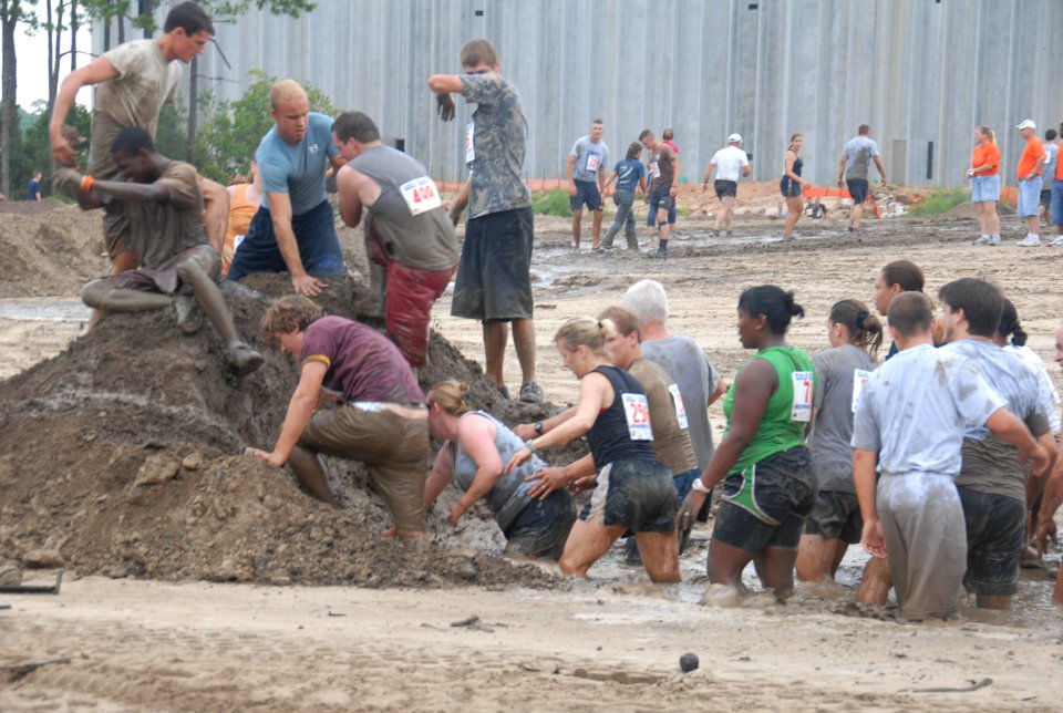 US Navy 080906-N-2468S-004 Participants of the 13th annual Seabee Volkslauf Mud Run complete an obstacle at Naval Construction Battalion Center Gulfport
