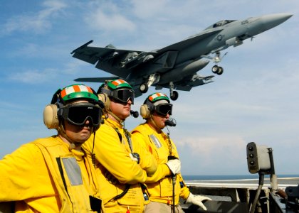 US Navy 080909-N-7571S-033 Flight deck personnel aboard the aircraft carrier USS Theodore Roosevelt (CVN 71) observe flight operations