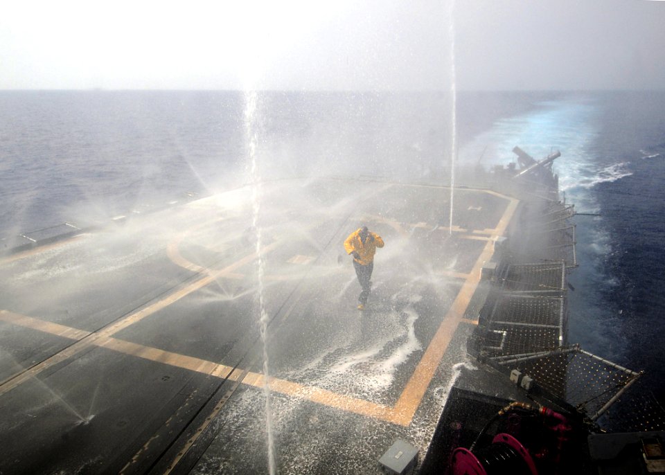 US Navy 080910-N-1082Z-044 Damage Controlman Chief Kevin Wright checks the effectiveness of the counter measure wash down system aboard the guided-missile cruiser USS Vella Gulf (CG 72)