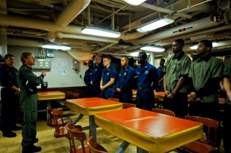 US Navy 111122-N-YM590-034 Rear Adm. Nora W. Tyson, commander of Carrier Strike Group (CSG) 2, left, speaks with Sailors during a visit aboard the photo
