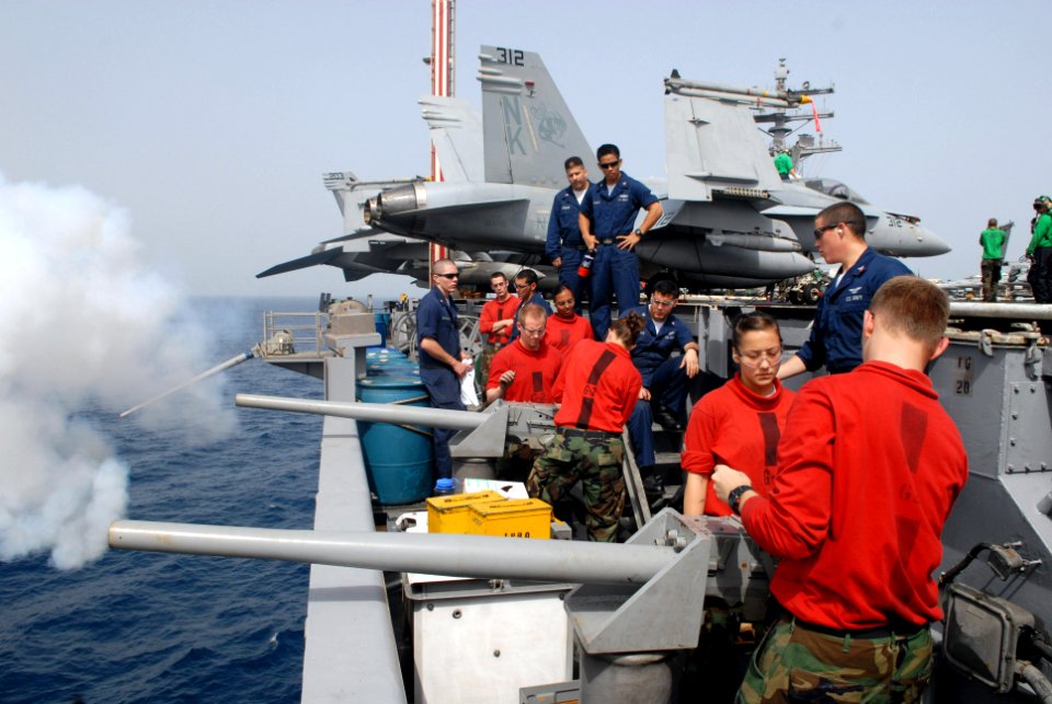 US Navy 080910-N-1635S-005 Sailors assigned to the weapons department aboard the aircraft carrier USS Ronald Reagan (CVN 76) fire 40mm cannons during a saluting battery practice